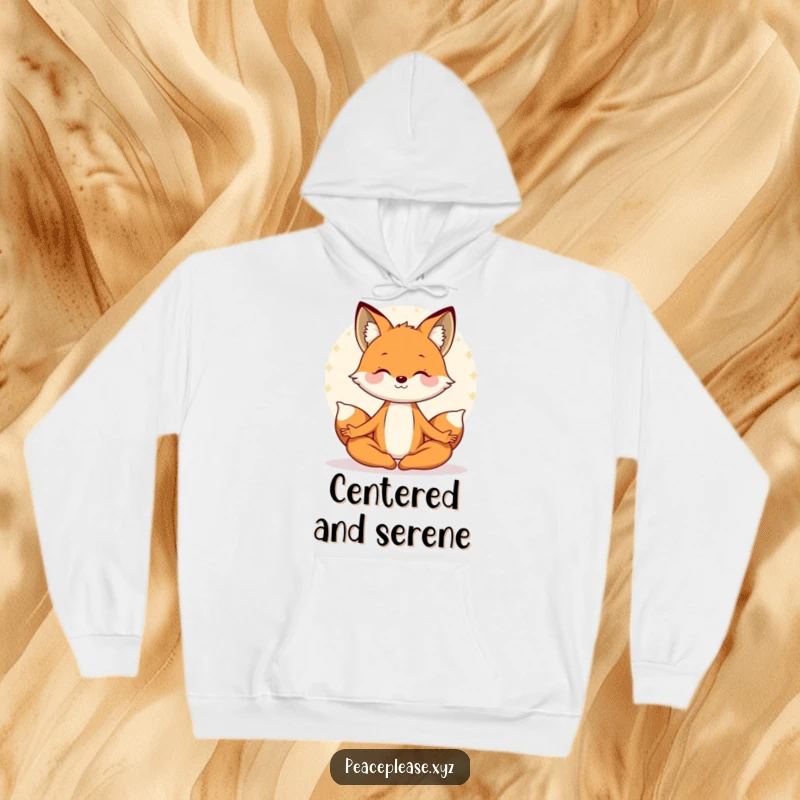 Funny hoodie featuring a smiling fox in a relaxed meditating pose, enveloped in a peaceful, serene aura. A cozy, humorous gift.